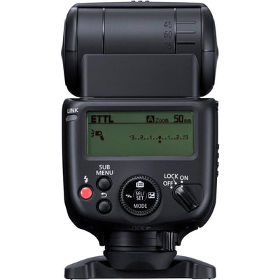 Canon Speedlite EL-10 on camera hot shoe — compact black flash unit with zooming flash head and built-in bounce diffuser card.