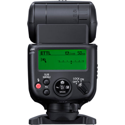Canon Speedlite EL-10 on camera hot shoe — compact black flash unit with zooming flash head and built-in bounce diffuser card.