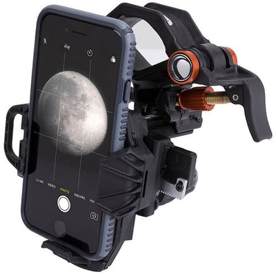 Phone with a moon image displayed on screen, held by a phone holder against a white background