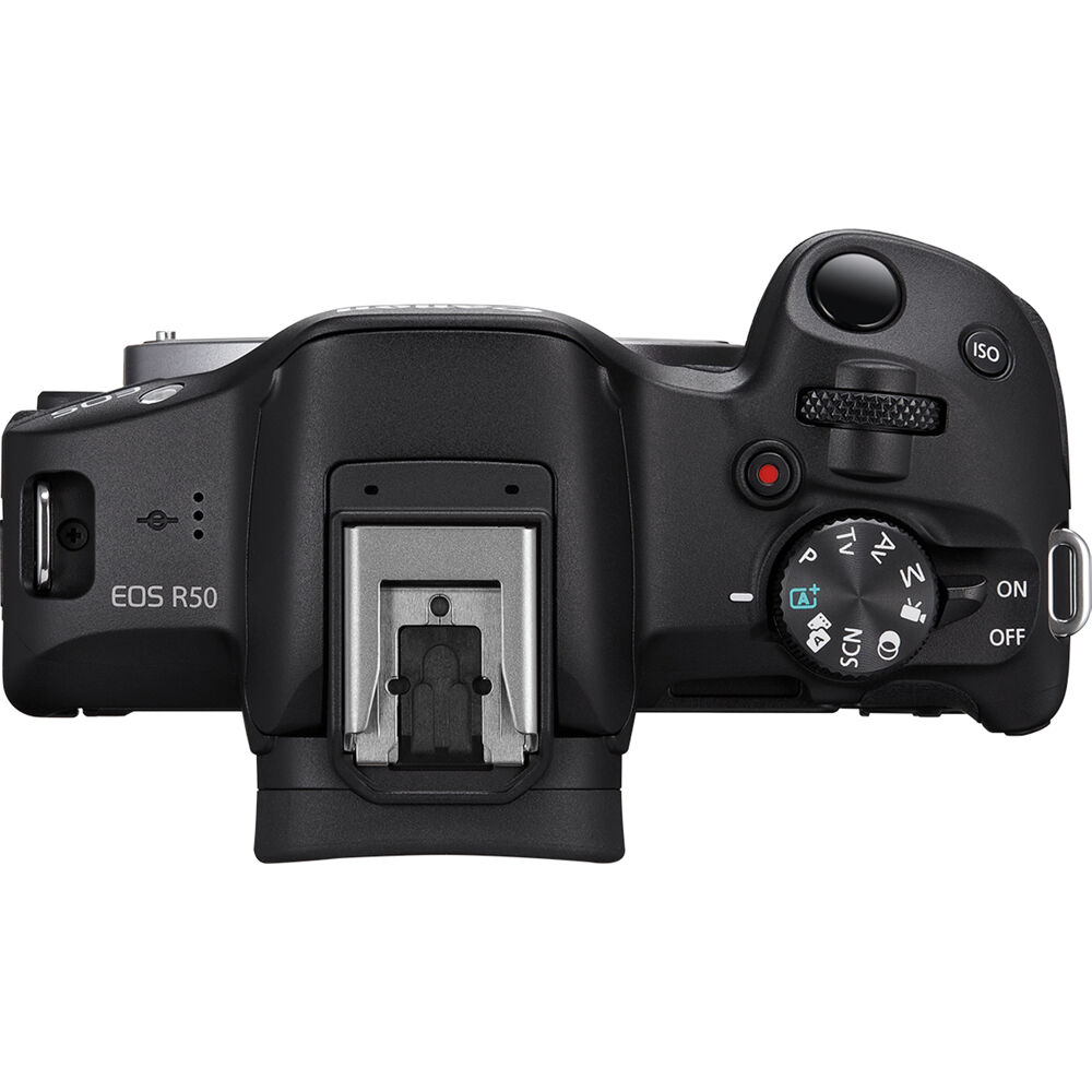 Canon EOS R50 Creator Kit with camera, mic, tripod grip, and 18-45mm lens.
