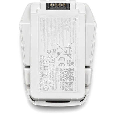 A black DJI Intelligent Flight Battery is shown, featuring a power button and four LED indicators.