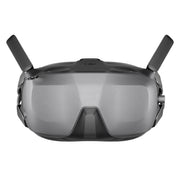 A pair of black DJI FPV Goggles is shown, with two adjustable antennas on top.