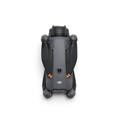 A grey DJI Mavic 4 Pro drone is shown from the front with its four arms extended and its triple-camera system visible