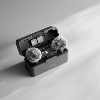 DJI Mic 3 wireless microphone system with transmitters, receiver, and charging case.