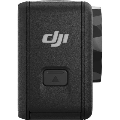 DJI Osmo Action 5 Pro action camera with front and rear OLED touchscreens, shown with included mounting accessories and protective case.