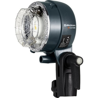Studio light with clear lens and black housing on a white background