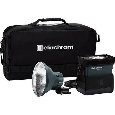 Elinchrom lighting equipment set with flash head and power pack on a white background