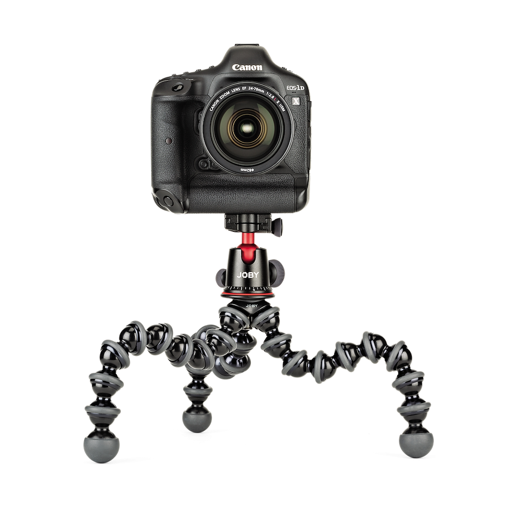 Canon camera mounted on a Joby gorilla pod stand on a white background