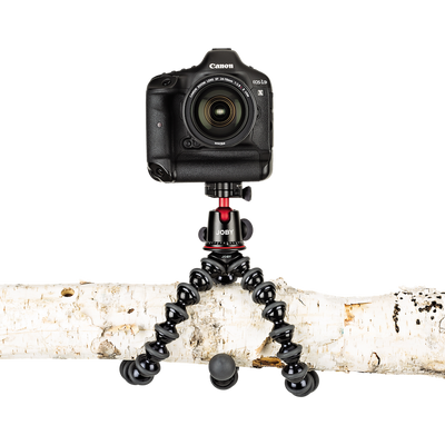 Canon camera on a Joby gorillapod stand with a white background
