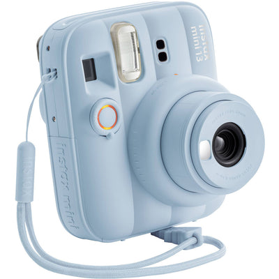 Frost Blue Instax Mini 13 with lens extended, showing wrist strap