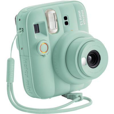Front-facing shot of Lagoon Green Instax Mini 13 with wrist strap