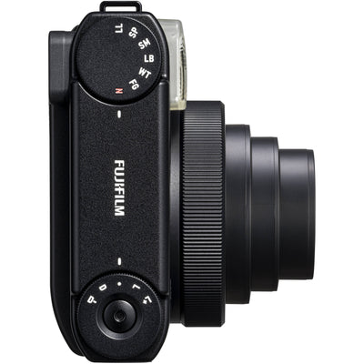 Fujifilm Instax Mini 99 instant film camera in vintage beige with textured grip, built-in flash, selfie mirror, and classic analog controls.