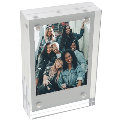 Fujifilm Instax Mini clear acrylic magnetic frame designed to hold and display Instax Mini photos securely with four magnets