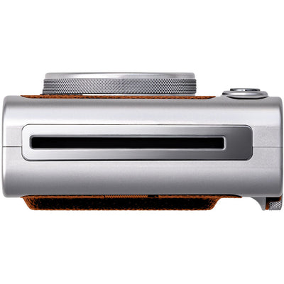 Fujifilm Instax Mini Evo Instant Film Camera (Brown) – stylish hybrid instant camera with retro brown design, digital display, lens and film effects, and instant printing.