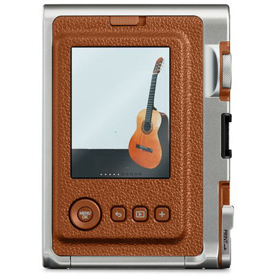 Fujifilm Instax Mini Evo Instant Film Camera (Brown) – stylish hybrid instant camera with retro brown design, digital display, lens and film effects, and instant printing.