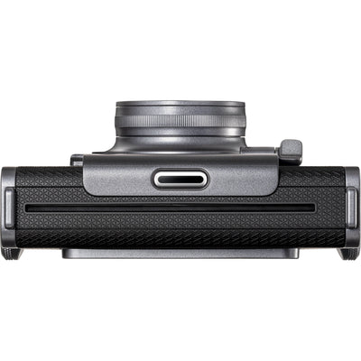 Fujifilm Instax Wide Evo hybrid instant camera with 16MP 1/3-inch CMOS sensor, fixed 16mm f/2.4 wide-angle lens, 10 lens and film effects, selfie mirror, built-in flash, tripod mount, and USB-C charging.