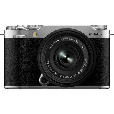 Fujifilm X-M5 silver mirrorless camera with XC 15-45mm f/3.5-5.6 OIS PZ compact zoom lens featuring 23-69mm equivalent focal length, 3-stop optical image stabilization, and smooth electric zoom