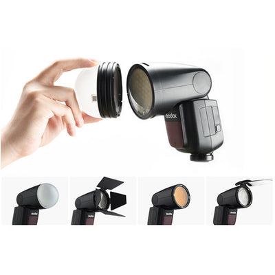 Godox V1-C round-head speedlight for Canon, featuring a compact cylindrical flash head, lith-ion battery grip, and OLED control panel.