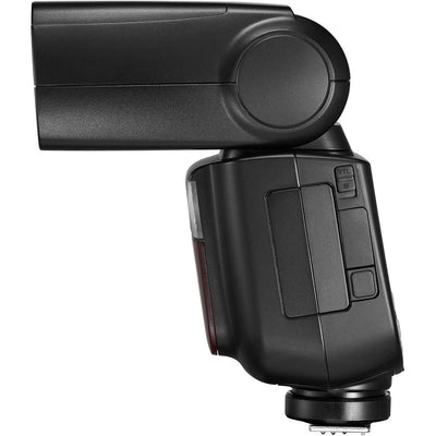 Godox V860 III speedlight for Canon, black flash unit with flip-up head, display panel, removable lithium battery, and accessories.
