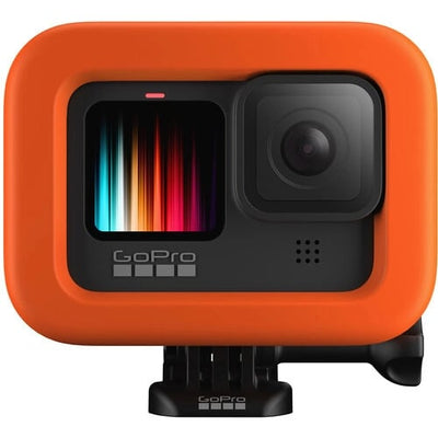 GoPro camera with orange protective case on a white background