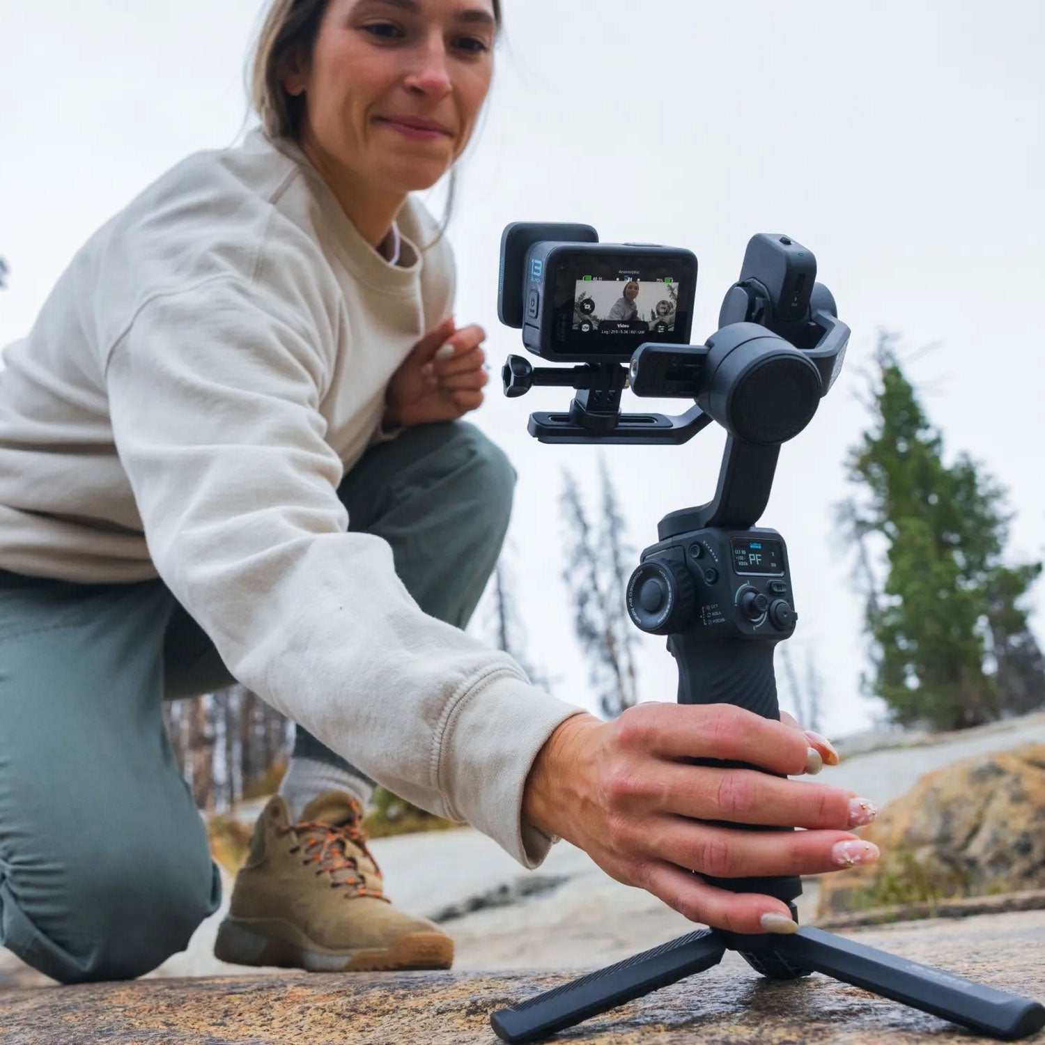 Premium 3-axis gimbal with AI subject tracking, integrated fill light, and mounts for smartphones and GoPro cameras.