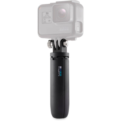 GoPro camera with black handle on a white background