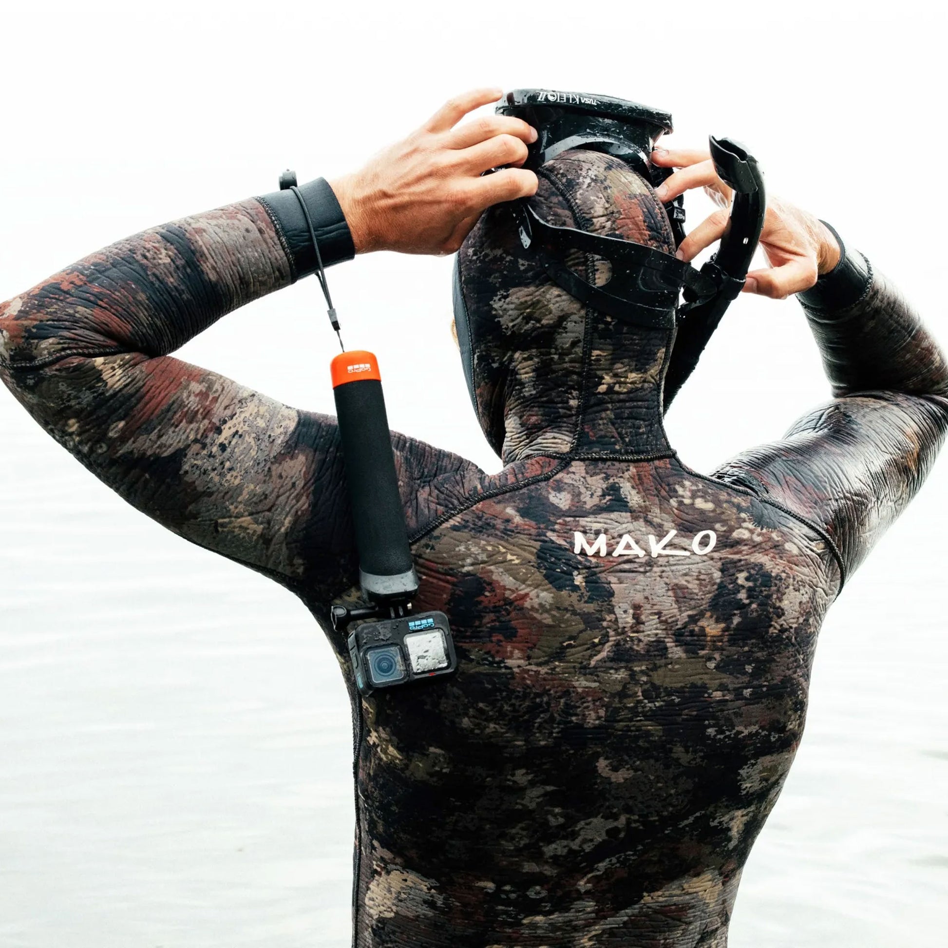 GoPro The Handler floating hand grip with orange base and quick-release camera mount
