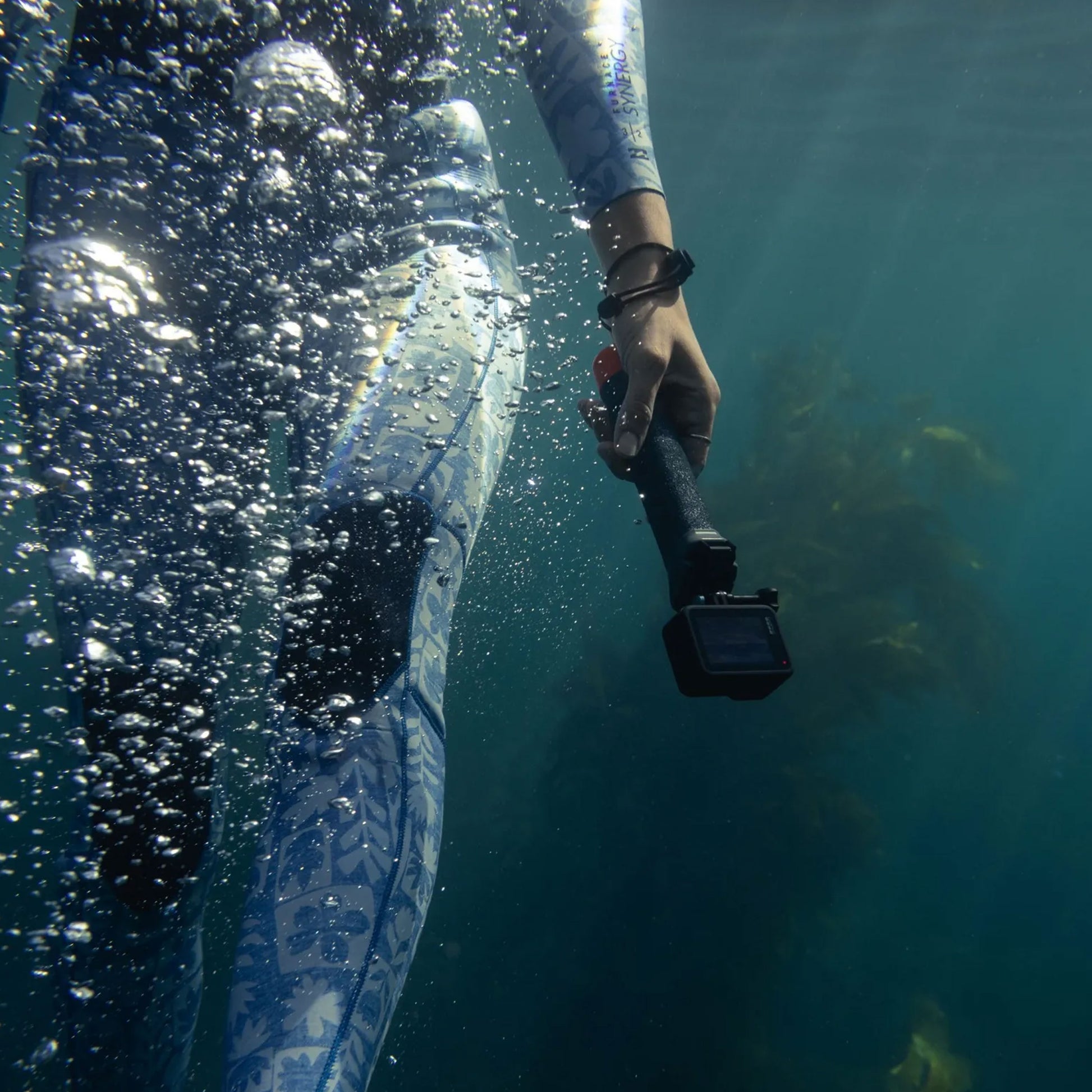 GoPro The Handler floating hand grip with orange base and quick-release camera mount
