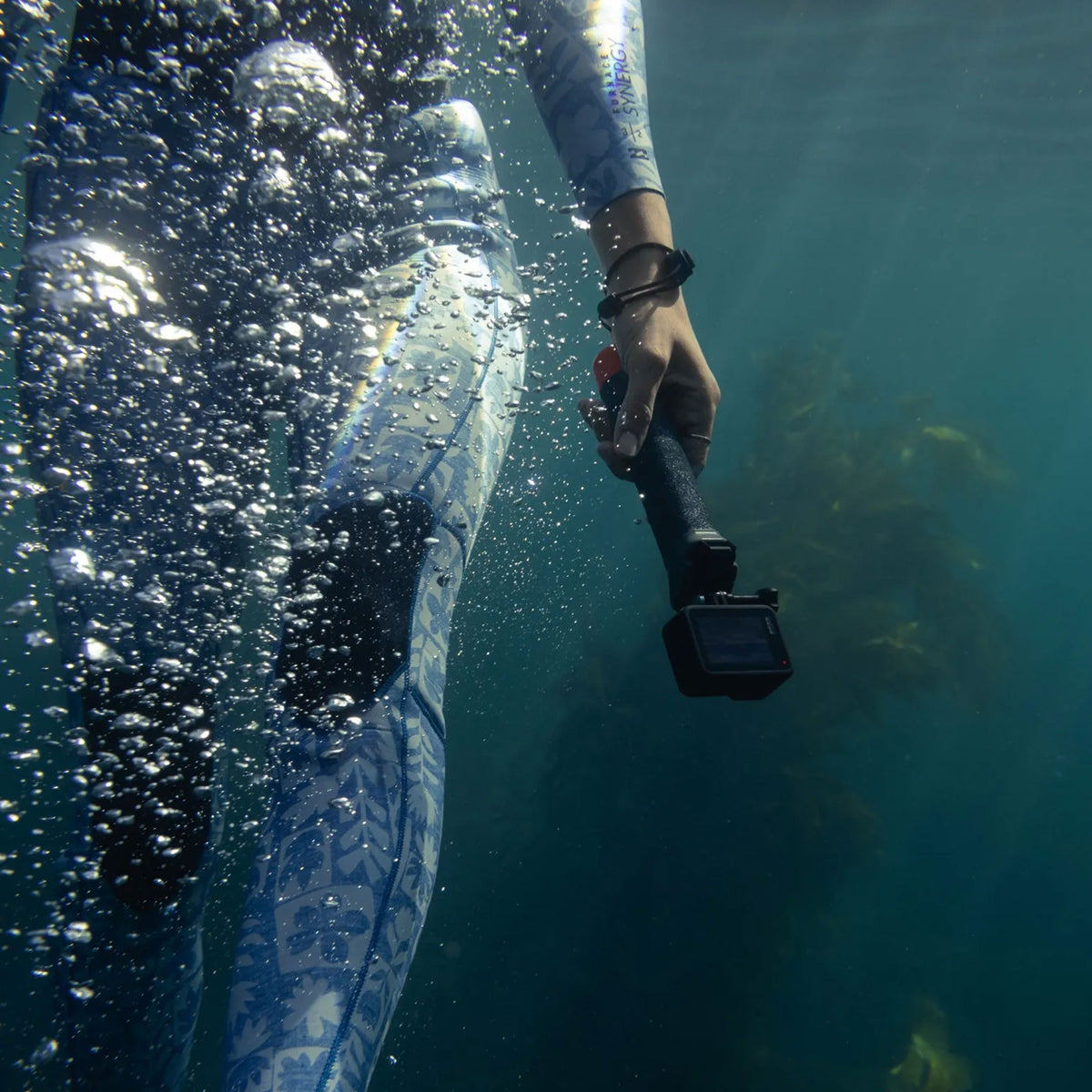 GoPro The Handler floating hand grip with orange base and quick-release camera mount
