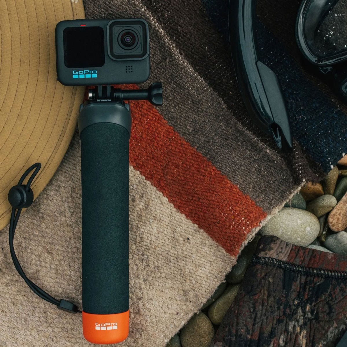 GoPro The Handler floating hand grip with orange base and quick-release camera mount
