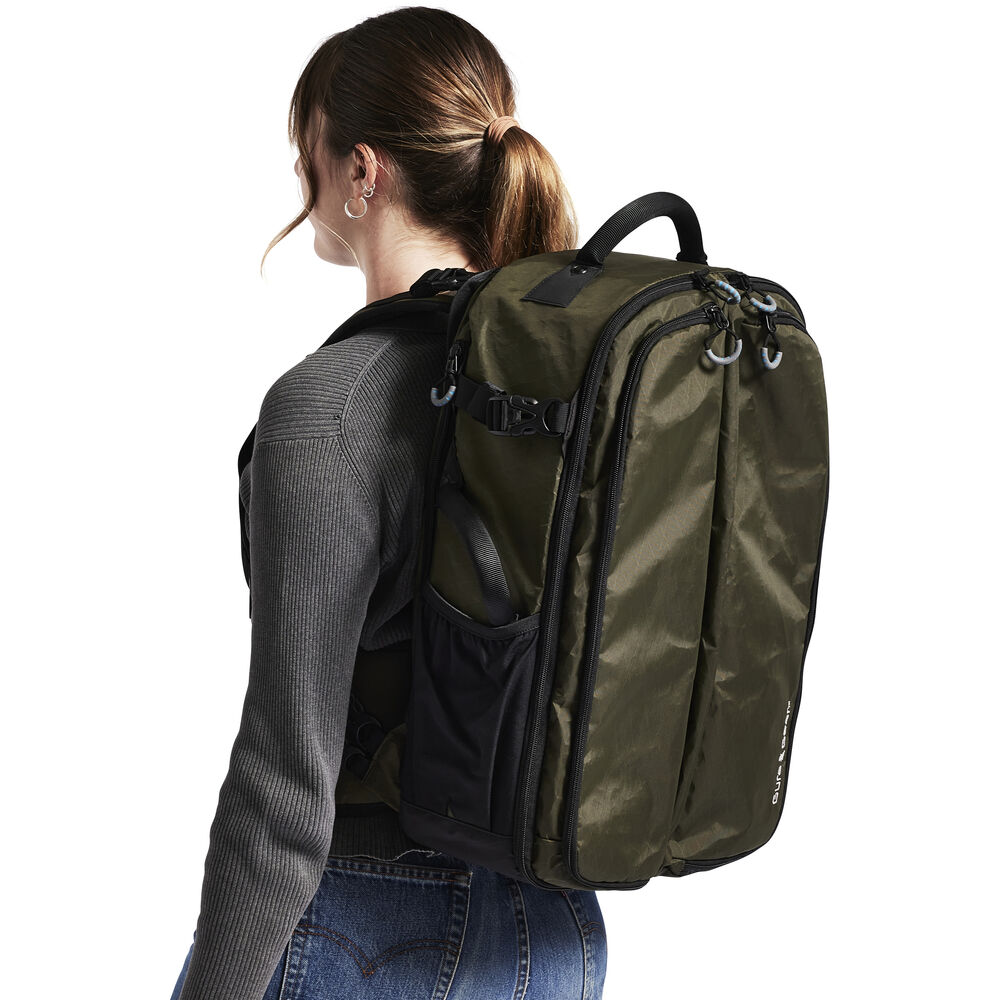 Forest Green Kiboko 30L+ camera backpack on model