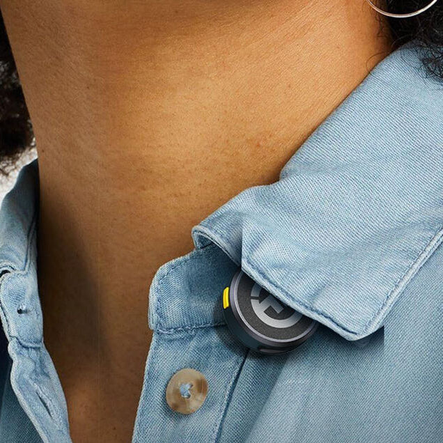 Hollyland Lark M2 transmitter attached to a shirt collar