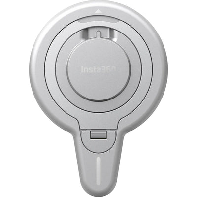 Insta360 Flow 2 Pro Magnetic Phone Mount with strong N52-grade magnets designed to securely hold MagSafe-compatible iPhone 12 or later models, featuring a 360° rotatable metal ring stand that doubles as a desktop phone stand, lightweight aluminum and silicone build, and compact 8.1 x 5.6 x 0.5 cm size.