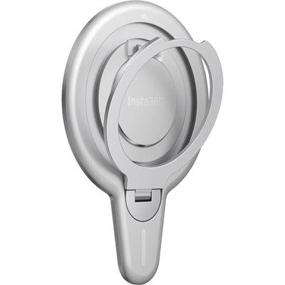 Insta360 Flow 2 Pro Magnetic Phone Mount with strong N52-grade magnets designed to securely hold MagSafe-compatible iPhone 12 or later models, featuring a 360° rotatable metal ring stand that doubles as a desktop phone stand, lightweight aluminum and silicone build, and compact 8.1 x 5.6 x 0.5 cm size.