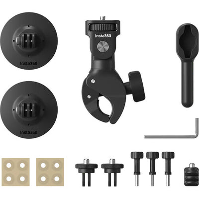 Insta360 X4 360° action camera in black with touchscreen display, bundled with motorcycle mounting accessories including heavy‑duty clamp, flexible adhesive mounts, invisible selfie stick, lens guards, thumb screws, and a 128 GB microSD card.
