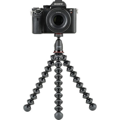 Camera mounted on a Joby gorilla pod stand with a white background