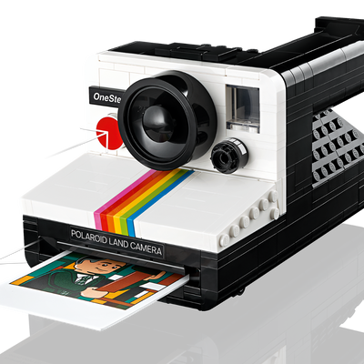 LEGO Ideas Polaroid OneStep SX-70 Camera set with 516 pieces, features a realistic build with working viewfinder, iconic Color Spectrum, turnable exposure dial, shutter button, and brick-built film pack that ejects photos