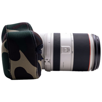 Camera lens with a camouflage lens cover on a white background