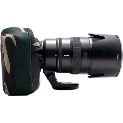 Nikon camera lens with camouflage case on a white background