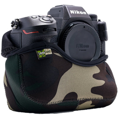 Nikon camera with a camouflage lens cover on a white background
