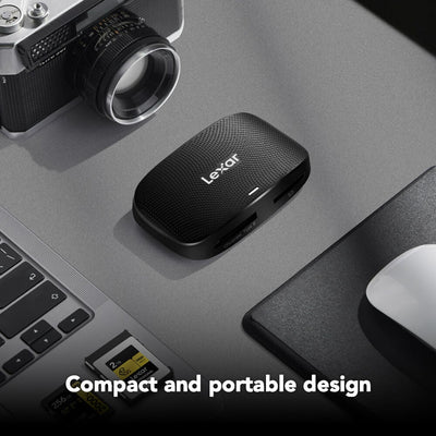 Lexar USB-C card reader on a desk with laptop, camera, and mouse.