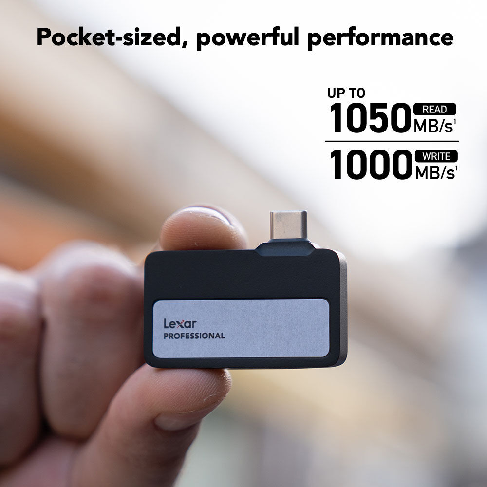 Lexar Professional memory card reader held in a hand with performance specifications displayed.
