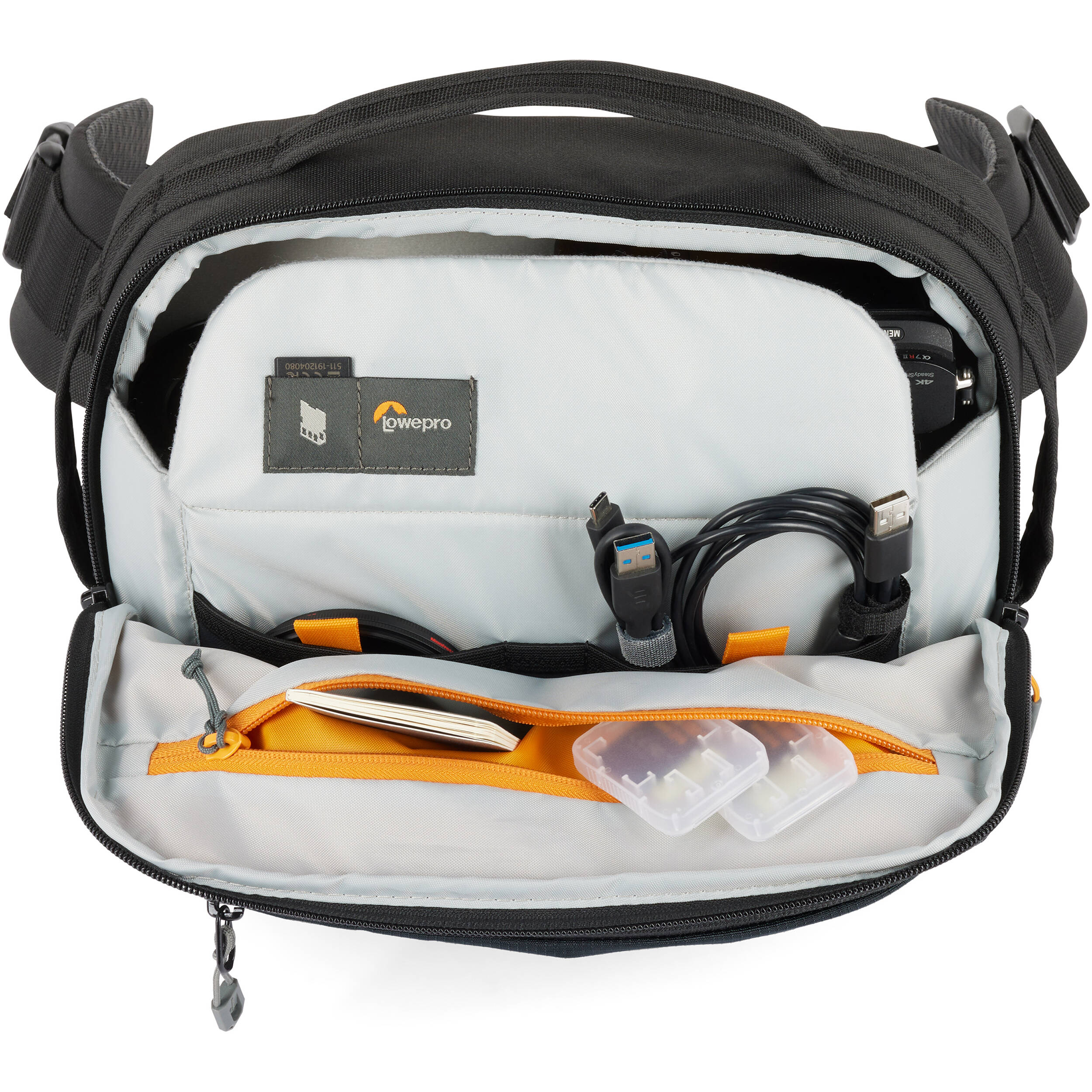 Eco-friendly Lowepro Trekker Lite SLX 120 camera bag with padded compartments and accessories
