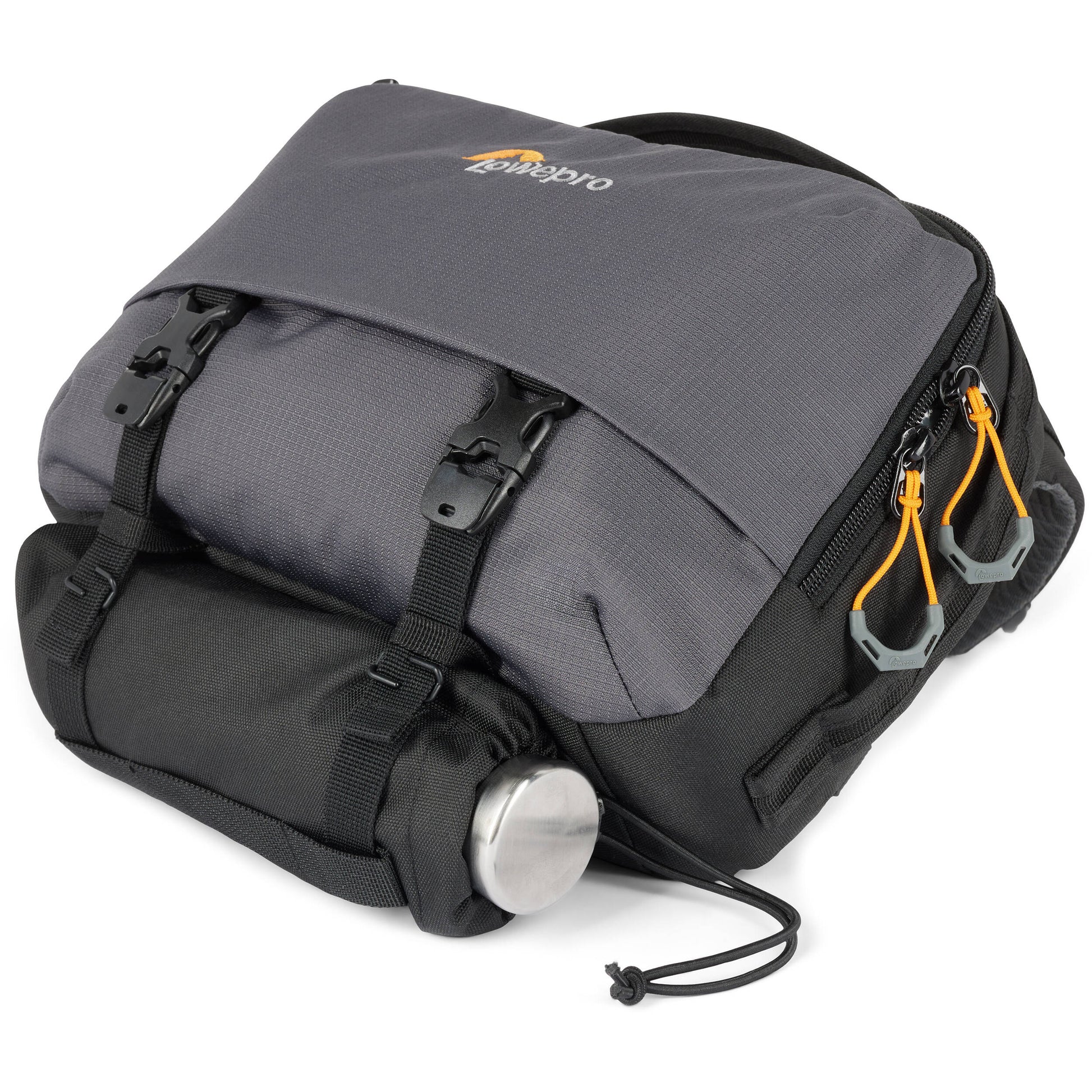 Eco-friendly Lowepro Trekker Lite SLX 120 camera bag with padded compartments and accessories
