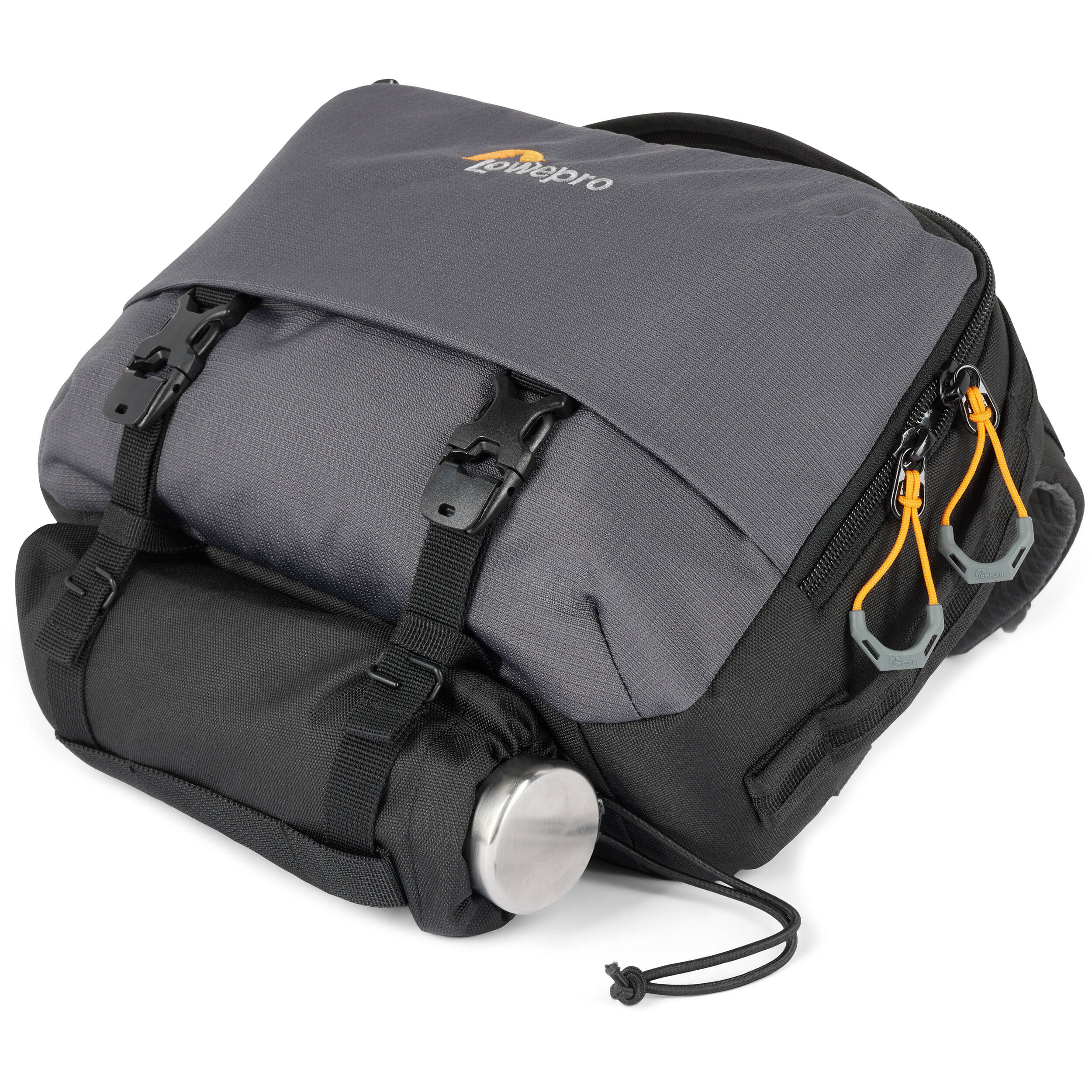 Eco-friendly Lowepro Trekker Lite SLX 120 camera bag with padded compartments and accessories

