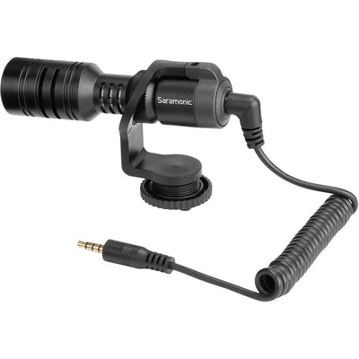 Nikon Z50 II Vlogging Kit in black featuring the Z50 II mirrorless camera body with attached NIKKOR Z 16–50 mm lens, alongside accessories including a compact vlogging LED light, shotgun microphone on cold shoe, handheld grip with wrist strap, and USB-C cable for charging.