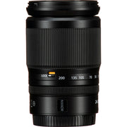 Black camera lens with focus distance markings on a white background