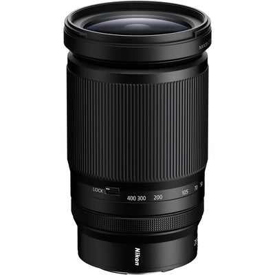 Black Nikon camera lens on a white background
