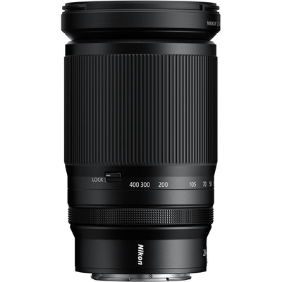 Black Nikon camera lens on a white background