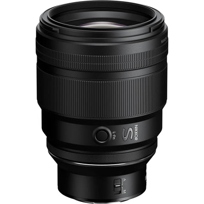 Black camera lens on a white background